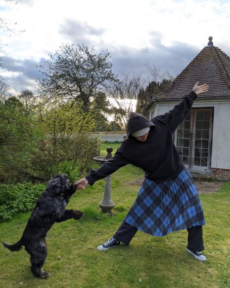 Emma Corrin in backyard of her house with Spence.